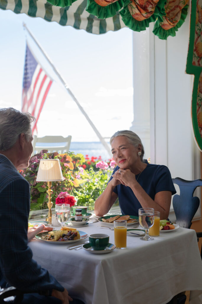 An older couple enjoying a nice breakfast at a waterfront hotel - The Grand Hotel Hospitality Marketing