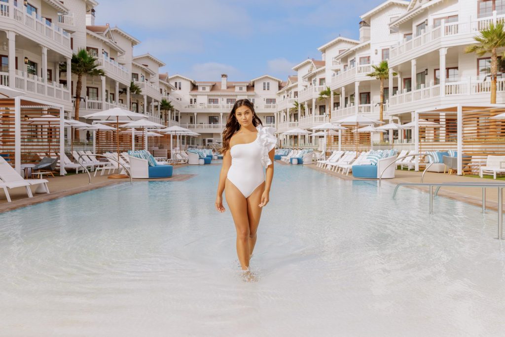 A young woman walking out of a hotel pool Hotel Photography - Shore House at the Del
