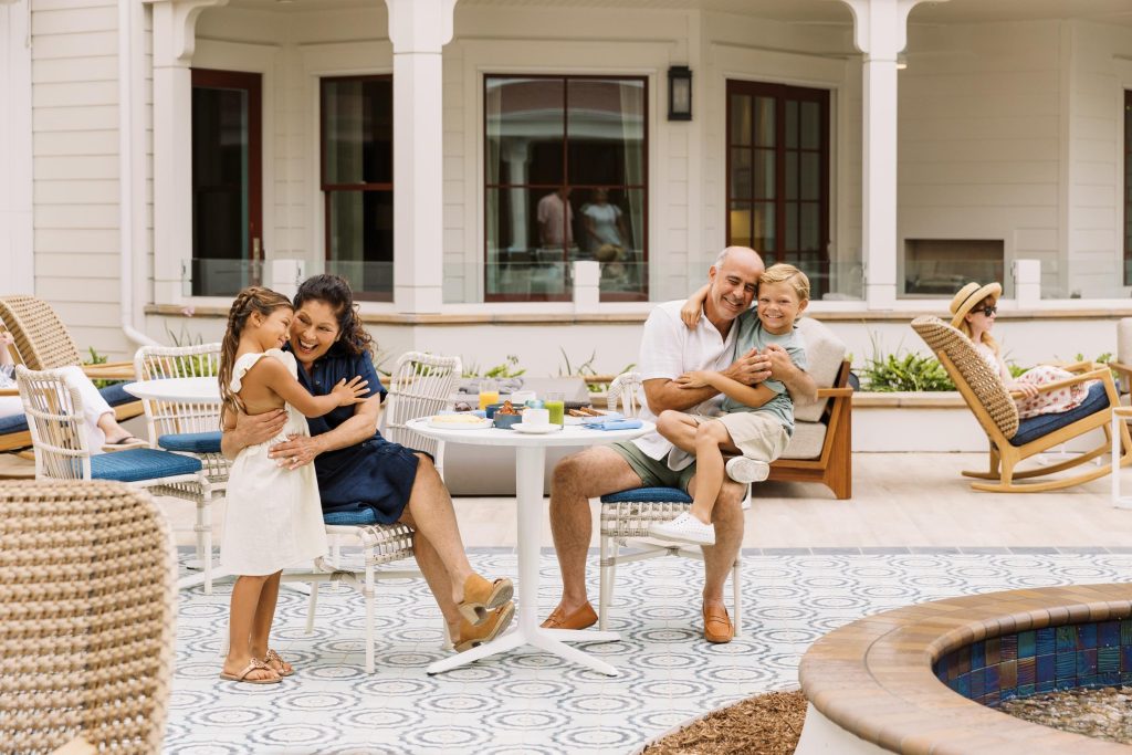 A family of grandparents and grand kids enjoying brunch outside at a nice hotel - Hotel Photography - Shore House at the Del