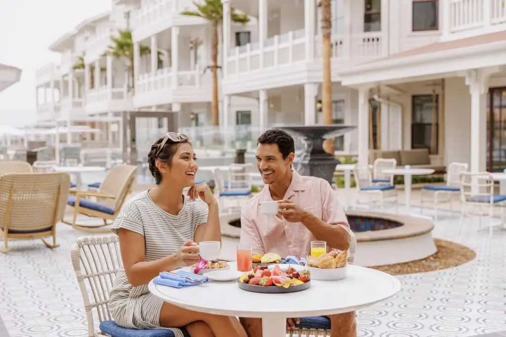 A young couple enjoying brunch outside at a nice hotel - Hotel Photography - Shore House at the Del