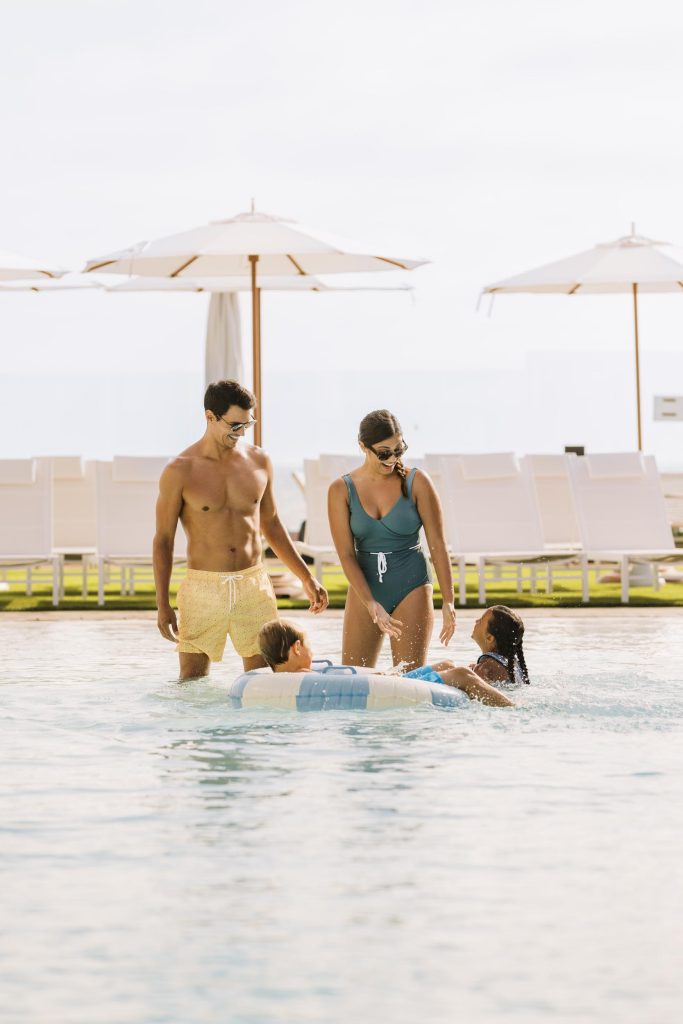 Young family having fun at a hotel pool Hotel Photography - Shore House at the Del