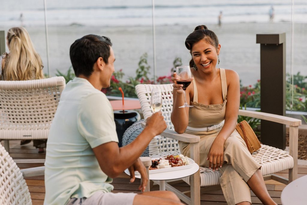 A young couple laughing at the Hotel Photography - Shore House at the Del