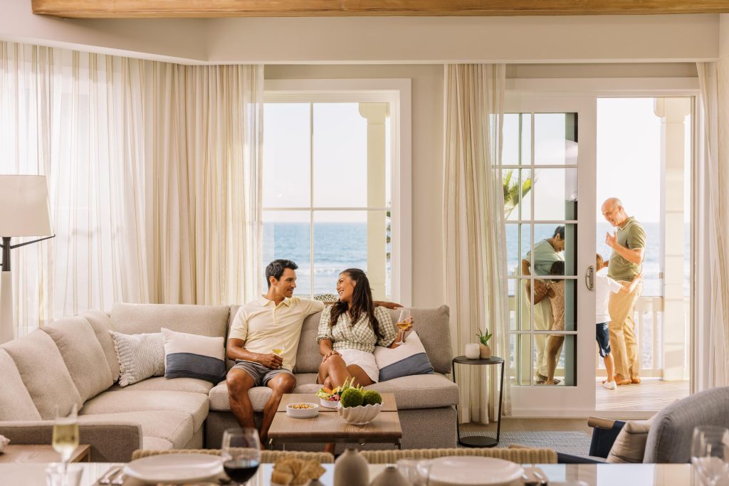 A family inside a upscale beach hotel room with balcony Hotel Photography - Shore House at the Del